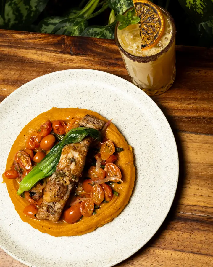 Catch of the day over sweet potato purée with cherry tomatoes