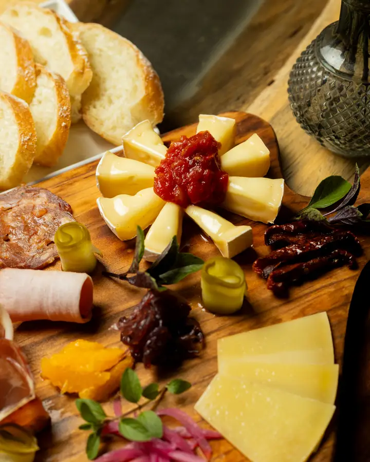 Charcuterie and cheese board with pickles and fruit